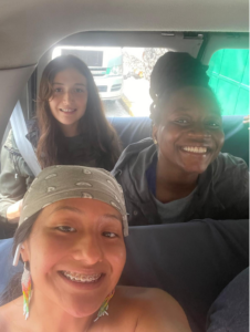 students smiling in the van